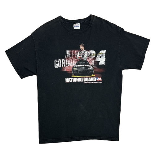 BLACK SHORT SLEEVE SHIRT WITH JEFFR GORDON ON THE FRON WITH NUMBER B24 AND NASCAR CAR. SAYS NATIONAL GUARD AT THE BOTTOM 