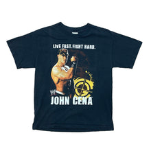 Load image into Gallery viewer, YOUNG JOHN CENA ON FRONT OF BLACK SHIRT WITH THE WORDS &quot;LIVE FAST. FIGHT HARD&quot; AND JOHN CENA NAME AT BOTTOM
