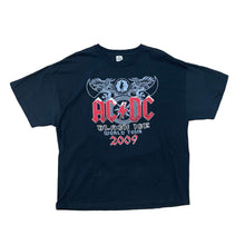 Load image into Gallery viewer, AC DC IN THE MIDDLE WITH RED LETTERING. BLACK SHIRT. BLACK ICE WORLD TOUR IN WHITE AND 2009 IN RED LETTERING. ANGUS PLAYING IN BACK GROUND WITH DEVIL HORNS.
