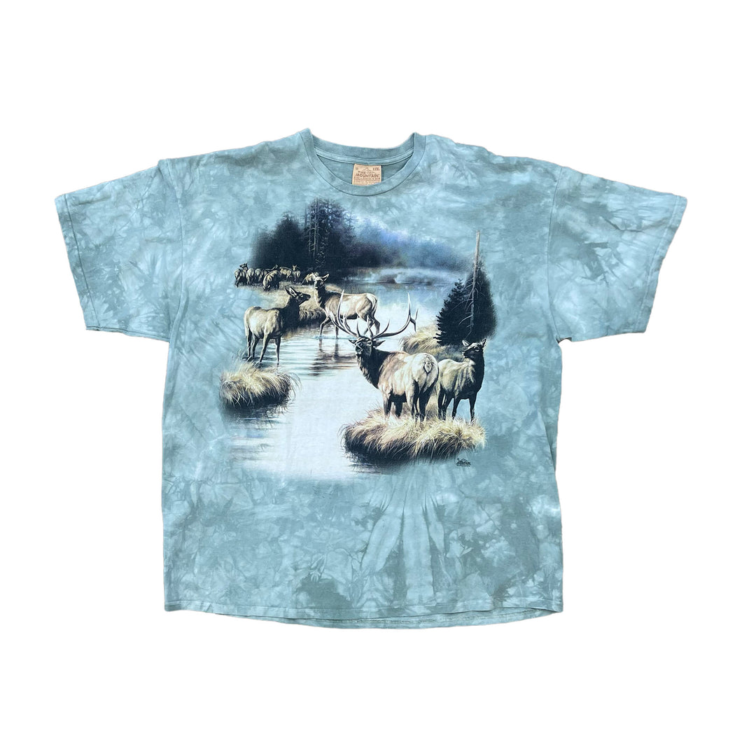 green mineral wash with elk and deer image on the front. all next to a river