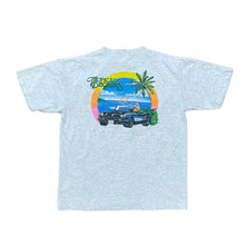 Load image into Gallery viewer, BACK OF SHIRT. OCEAN WITH PALM TREES AND SPORTS CAR IN THE MIDDLE. TROPICAL DEGREES IN GREEN AND FLORIDA IN PINK. HEATHER GREY SHIRT
